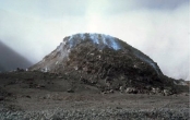 What types of rocks would be most common in the volcano in this photograph?   A)  scoria and other vesicular basalt B)  basalt mostly formed in lava flows C)  felsic and intermediate lava flows D)  pillow basalts E)  none of these