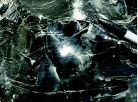 This dark gray igneous rock is glassy and elsewhere contains small vesicles and flow bands. What kind of eruption probably formed this rock?   A)  eruption of a low-viscosity, basaltic lava flow B)  eruption of high-viscosity lava in a dome C)  dome collapse that forms volcanic breccia D)  eruption of a pyroclastic flow that forms a thick and hot deposit E)  slow settling of ash from a tall eruption column forming a nonwelded tuff