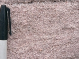What type of rock is shown in this photograph?   A)  conglomerate B)  breccia C)  sandstone D)  siltstone or shale