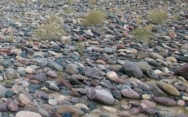 Imbricated clasts in this river means that:   A)  the wind was blowing from left to right B)  the rocks have been shuffled by ground shaking during an earthquake C)  the rocks have slid downhill to the right D)  the current flowed from right to left