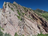 What type of deformation is shown in this photograph?   A)  displacement B)  rotation C)  internal strain of the rock D)  columnar joints