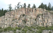 What type of structure is expressed in this cliff face?   A)  normal faults B)  reverse faults C)  joints D)  folds