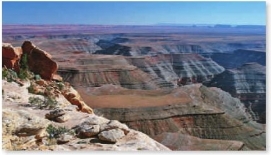 Which principle can be used by a geologist to determine that the rocks shown in the photograph have not been deformed since they were deposited?   A)  Original horizontality B)  Superposition C)  Cross-cutting relations