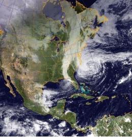 Considering the history of Hurricane Sandy, what did Sandy do after the time shown by this satellite image,? A) It turned eastward across the Atlantic Ocean, sparing the land. B) It collided with a storm system coming eastward across the continent. C) It turned south and caused damage in the Caribbean. D) It turned southwest and caused damage to Florida.