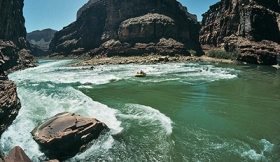 Deposition in bedrock channels occurs along river banks and behind obstacles as:   A)  water velocity decreases B)  water velocity increases C)  the gradient increases