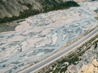 What type of stream is shown in this photograph?   A)  meandering stream B)  braided stream C)  a stream whose main channel has high sinuosity D)  an esker