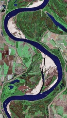 What type of stream is shown in this figure?   A)  braided stream B)  a stream whose channel has a low sinuosity C)  meandering stream D)  a stream that lacks point bars E)  all of these