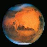 This planet has bedrock, reddish dust, and ice caps. What planetary body is it?   A)  Mars B)  Venus C)  Earth's moon D)  Mercury E)  Neptune