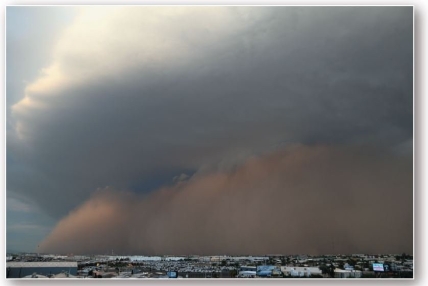 <strong> a()Ground view b()Aerial view Dust storms engulf Phoenix,Arizona,in 2013 (ground view)and 2016 (aerial view). Dust storms,such as one from Arizona in 2013,are caused by downbursts associated with thunderstorms.Such storms are termed</strong> A)playas. B)deflation. C)blowout depression. D)ventifacts. E)haboobs.