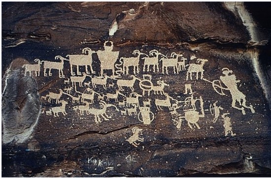 What does this ancient petroglyph tell us about the people who made it?   A)  The people who crafted this were part of a farming society. B)  The people who crafted this were part of a hunting society. C)  Only women were hunters in this society. D)  This society honored its dead with large murals.