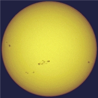 The figure shows the Sun and pairs of sunspots. One could say that there is really a 22-year sunspot cycle because   A) the time between sunspot number maxima is 22 years. B) the time between maxima of the same magnetic polarity of sunspot pairs is 22 years. C) it takes sunspots 22 years to move from the poles to the equator. D) at maximum there are 22 sunspots per year.