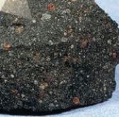 In this image, chondrules are present. What kind of meteorite is this   A) stony B) stony-iron C) iron D) chondrite