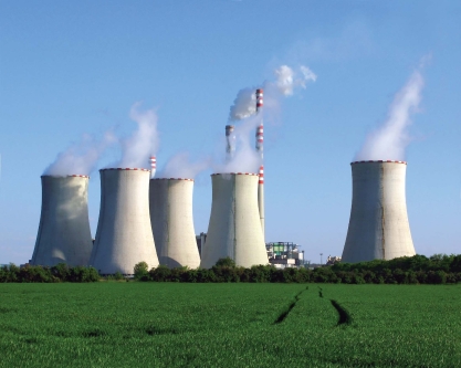   -The large structures in this photograph are A) smokestacks from a coal-fired power plant. B) special wind turbines that capture swirling wind to produce electricity. C) towers used to cool water heated by a coal-fired power plant. D) combustion chambers used to burn natural gas to generate electricity.