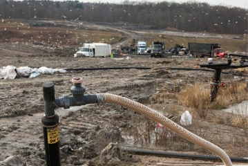   -The well in this landfill in the foreground of the photo is most likely being used to A) recycle plastics. B) process leachate. C) capture methane. D) recycle heavy metals.