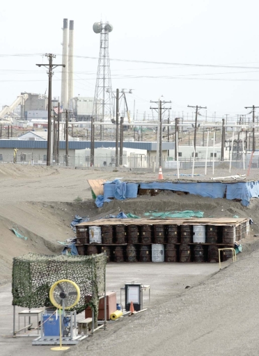   -The hazardous-waste disposal system illustrated in this figure represents A) a secure landfill. B) a deep-well injection. C) an on-site surface impoundment. D) a best-demonstrated available technology.