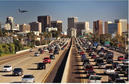   -The dense traffic and wide highways illustrated in this photograph are the result of A) state sales taxes diverted from city services. B) federal income taxes which are higher in urban areas. C) the Highway Trust Fund's gasoline tax revenue. D) the Department of Urban Renewal.