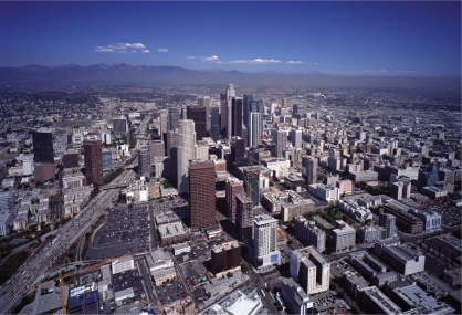   -The city in this photograph illustrates a city that is A) car-centered. B) people-centered. C) industry centered. D) environmentally friendly.