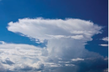 What is the name given to the windblown top of the thunderstorm in the following picture?   A)  squall line B)  gust front C)  anvil D)  occluded front E)  eye