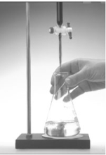  A hydrochloric acid solution is standardized by titrating against solid sodium carbonate as shown in the following image.The HCl is in the buret and the sodium carbonate in the flask.   The equation is 2 HCl(aq) + Na<sub>2</sub>CO<sub>3</sub>(s)  \rightarrow  2 NaCl(aq) + H<sub>2</sub>O(   ) + CO<sub>2</sub>(g) .If 23.4 mL of the solution is added from the buret to neutralize 0.157 g Na<sub>2</sub>CO<sub>3</sub> in the flask.what is the molarity of the HCl solution? A) 0.0316 M B) 0.0633 M C) 7.90 M D) 0.253 M E) 0.127 M 