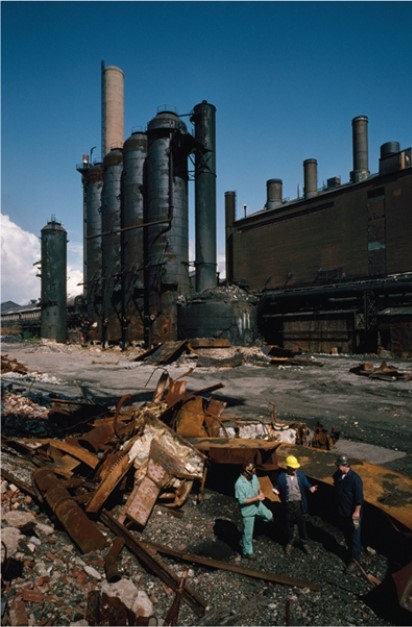 For this question,refer to the following photograph of an old steel mill being demolished during the 1980s.   Which of the following was an important effect of the historical process depicted in the photograph above? A)  A decline in union membership B)  A surge in migration to the United States C)  Criticism by conservatives for failing to transform the economic status quo D)  Debates over the impact of economic consumption on the environment