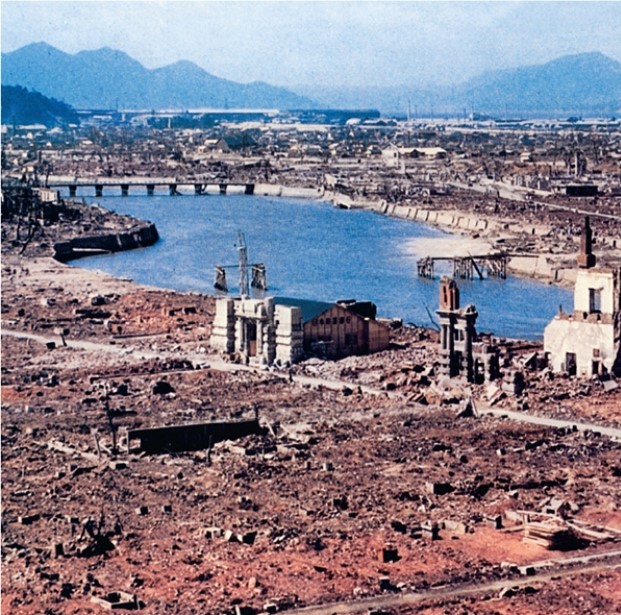 The photograph below is best understood in the context of   A)  U.S.efforts to contain Soviet-dominated communism through a variety of measures. B)  the pursuit of a unilateral foreign policy by the United States. C)  debates between interventionists and isolationists. D)  the vaulting of the United States into global military and political prominence.