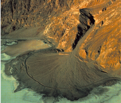 The figure below illustrates a(n)__________, which is common where streams emerge from mountains.   