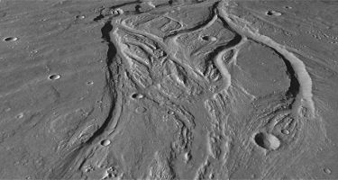 Below is an oblique view showing landforms on Mars.What process is most likely responsible for creating this landscape?   A)  glacial carving B)  deposition C)  flowing water D)  burrowing