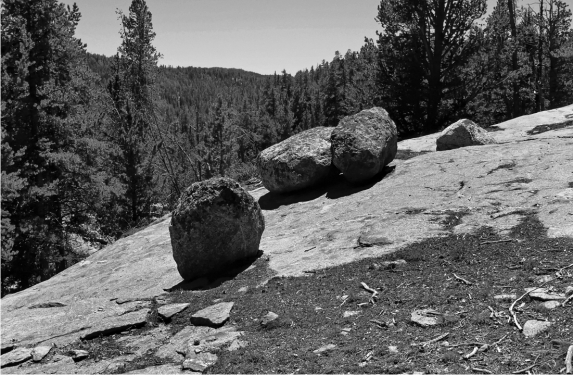 Notice the boulders in the center of this picture of a glacially formed landscape.What are they? How did they get there?  