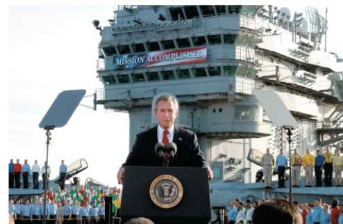   Credit: Scott J.Applewhite/AP Images -How does the photo illustrate a  rally event  as it relates to public approval of the president? A) George H.W.Bush's popularity soared after the Gulf War.-Consider This: If Bush had successfully won reelection,this would have been a rallying event.Unfortunately for Bush,he lost. B) The army backed George W.Bush's military plans. C) George W.Bush's popularity surged after initial success in Afghanistan. D) George W.Bush convinced Americans to support TARP.