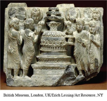 Why are the people depicted in this statue keeping their gaze turned inward as they circumambulate the stupa?   A)  To display respect for one another B)  To keep Buddhism's teachings at the center of their lives C)  To display reverence to Buddhist monks D)  To attain enlightenment