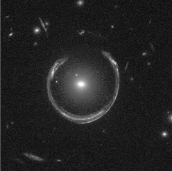 The phenomenon pictured in the figure below is an example of   A)  a supernova remnant. B)  a black hole. C)  gravitational lensing. D)  a gamma-ray burst. E)  gravitational waves.