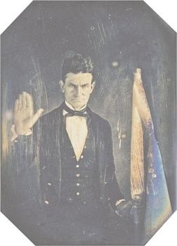   -What did John Brown's raised right hand in this daguerreotype taken by black photographer Augustus Washington indicate? A)  Brown pledged to destroy slavery in the United States. B)  The five fingers on his hand represented his support for the five different parts of the Compromise of 1850. C)  Brown was being sworn in as an antislavery member of the state legislature in Kansas. D)  Brown was showing how many proslavery settlers he killed at Pottawatomie Creek, Kansas.