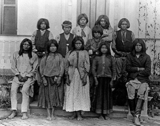 <strong> What did these 1890s before-and-after photographs of Chiricahua Apache children at the Carlisle Boarding School in Pennsylvania reveal about the expectations for Native Americans under the Dawes Severalty Act?</strong> A) Supporters of the boarding school program opposed the trauma and cultural genocide that resulted from boarding school education. B) Maintaining traditional customs and culture was essential when educating Native Americans. C) Native Americans were more successful if they received reservation-based education. D) Complete assimilation was the only way for Native Americans to survive in the United States.