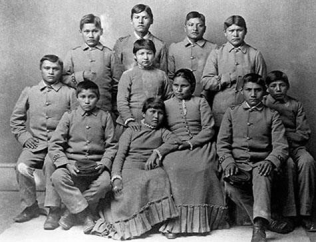 <strong> What did these 1890s before-and-after photographs of Chiricahua Apache children at the Carlisle Boarding School in Pennsylvania reveal about the expectations for Native Americans under the Dawes Severalty Act?</strong> A) Supporters of the boarding school program opposed the trauma and cultural genocide that resulted from boarding school education. B) Maintaining traditional customs and culture was essential when educating Native Americans. C) Native Americans were more successful if they received reservation-based education. D) Complete assimilation was the only way for Native Americans to survive in the United States.