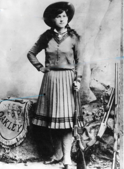 <strong> As seen in this photograph, Annie Oakley was typically portrayed as .</strong> A) a strong woman bent on challenging traditional gender roles B) a performer whose apparent skill was probably fake C) upholding Victorian mores and values D) combining feminine beauty with masculine strength