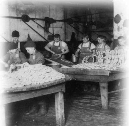   -What was the major reason why many children, such as these young boys working in a sausage factory, were hired as laborers by industrial employers? A)  Employers preferred hiring children over minority or female workers. B)  Employers could pay children less than one-half the wages of an adult laborer. C)  Children could be supervised by a parent or relative while working in the factories. D)  Children were able to perform more delicate tasks than what adult workers could do.