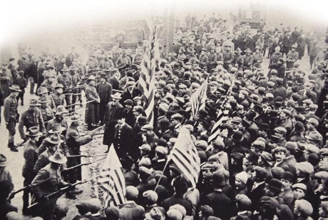 <strong> What was the immediate Progressive reaction to this 1912 photograph depicting a stand-off between the state militia and striking textile workers in Lawrence, Massachusetts?</strong> A) They developed greater sympathy for working-class immigrants. B) They were fearful that the strike would turn violent. C) They wanted to find a legal way to curb the power of big business. D) They sought ways to give labor unions more power over their employers.
