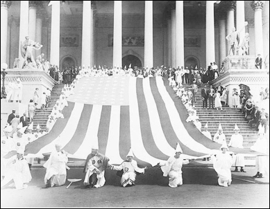     -Based on this souvenir postcard from a lynching in Marion, Indiana, and the photograph of the 1925 Ku Klux Klan march in Washington, D.C., what conclusion can be reached about both lynch mobs and the Ku Klux Klan during the 1920s? A)  They revived their activities after being suppressed during Reconstruction. B)  Their targets included not only African Americans, but also Jews, Catholics, immigrants and feminists. C)  They were unashamed of their actions and unafraid to reveal their identities. D)  Although they were usually prosecuted for their crimes, juries rarely found them guilty.