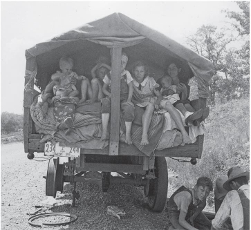 <strong> A migrant family such as the one pictured in this Dorothea Lange photograph was most likely headed _.</strong> A) to the orange groves of Florida B) to the factories of the Midwest or East C) toward farms as far west as California D) across the border to Mexico