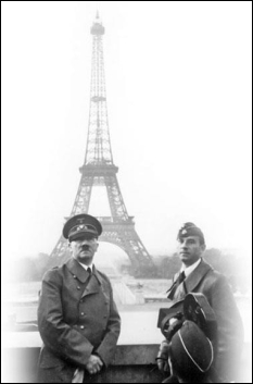   -Why did Adolf Hitler choose to pose in front of the Eiffel Tower in this photograph taken in Paris after the fall of France in 1940? A)  He wanted to highlight France's defeat and his own power. B)  The tower symbolized the same industrial advancements that Germany had accomplished. C)  He was a great admirer of Parisian architecture. D)  He wanted to honor the tower's designer, who had been born in Germany.