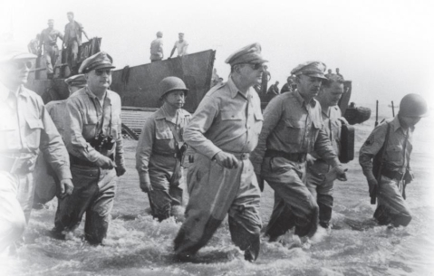   -What was General MacArthur's primary purpose in inviting the press to photograph him in this carefully choreographed act after his return to the Philippines in 1944? A)  to instill pride and confidence in the troops B)  to encourage U.S. leadership to abandon its  Europe First  strategy C)  to intimidate his Japanese enemies D)  to satisfy his own ego