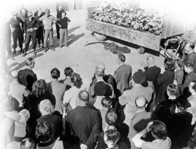   -Why did American forces make German citizens view and even bury the bodies of Holocaust victims, such as they did with these people at the recently-liberated Buchenwald concentration camp? A)  to acknowledge that the Allies were the liberators of these concentration camps B)  to thank these Germans for their efforts in trying to save Jews and other victims C)  to prepare them for their own executions for violations of human rights D)  to make all Germans accept responsibility for their nation's war crimes