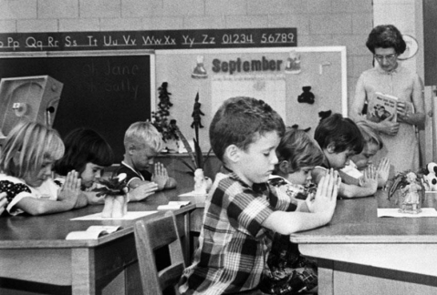   -The image pictured here is most closely associated with the issues that led to the Supreme Court case of _. A)  Brown v. Board of Education B)  Loving v. Virginia C)  Engel v. Vitale D)  Gideon v. Wainwright