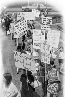 <strong> This photograph of women marching at a 1970 St. Louis, Missouri, protest march on the 50th anniversary of the ratification of the Nineteenth Amendment reveals that .</strong> A) many of the demonstrators were members of the pro-life movement B) the Equal Rights Amendment had been ratified by the states C) legalized abortion had been passed by the U.S. Supreme Court D) there were many unresolved issues that women still had to address through protest