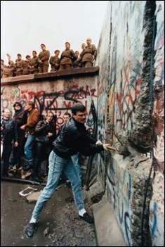     -How do these images of the man with the hammer in Berlin and  Tank Man  in Beijing's Tiananmen Square tell two different stories about Communism in Eastern Europe and China in the late 1980s? A)  Eastern European nations suffered severe retaliations for demonstrating against Communism, while Chinese officials responded with economic and political reforms. B)  Soviet troops invaded protesting Eastern European nations, while the Chinese were more responsive to human rights. C)  The man with the hammer was arrested and probably executed for his actions, while  Tank Man  became known for his defense of human rights. D)  Communism in most of Eastern Europe fell through peaceful demonstrations, while demonstrators in China were unsuccessful in their attempts to bring about reform.