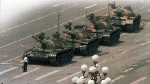     -How do these images of the man with the hammer in Berlin and  Tank Man  in Beijing's Tiananmen Square tell two different stories about Communism in Eastern Europe and China in the late 1980s? A)  Eastern European nations suffered severe retaliations for demonstrating against Communism, while Chinese officials responded with economic and political reforms. B)  Soviet troops invaded protesting Eastern European nations, while the Chinese were more responsive to human rights. C)  The man with the hammer was arrested and probably executed for his actions, while  Tank Man  became known for his defense of human rights. D)  Communism in most of Eastern Europe fell through peaceful demonstrations, while demonstrators in China were unsuccessful in their attempts to bring about reform.