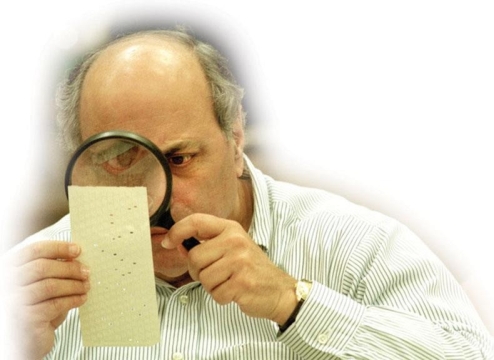 <strong> What made this photograph an iconic image of the 2000 presidential election?</strong> A) It revealed the U.S. Supreme Court's partisanship in determining who would be the next President of the United States. B) It addressed the issue of voter fraud that Democrats charged Republicans with in Florida because of alleged African American voter suppression. C) It addressed the drawn-out and controversial recount in Florida that was caused in part by hanging chads on electronic ballots. D) It showed that, in the age of machine-counted votes, the public received instantaneous communication about election results.
