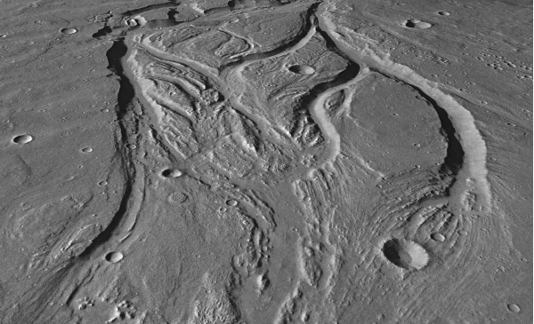 Below is an oblique view showing landforms on Mars.What process is most likely responsible for creating this landscape?   A)  glacial carving B)  deposition C)  flowing water D)  burrowing