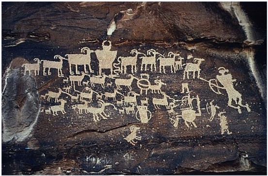 What does this ancient petroglyph tell us about the people who made it?   A)  The people who crafted this were part of a farming society. B)  The people who crafted this were part of a hunting society. C)  Only women were hunters in this society. D)  This society honored its dead with large murals.