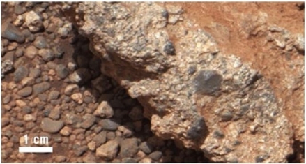   What kind of rock is visible in this image from Mars? A) Basalt B) Shale C) Conglomerate D) Granite